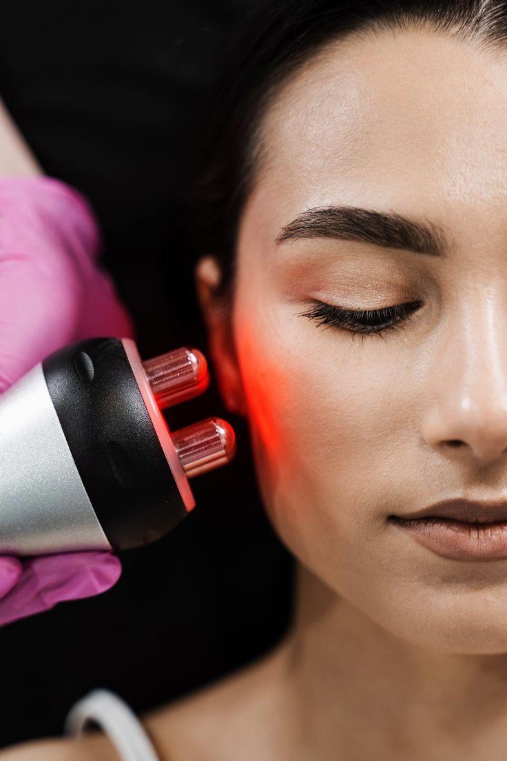 Woman receiving radiofrequency facial treatment