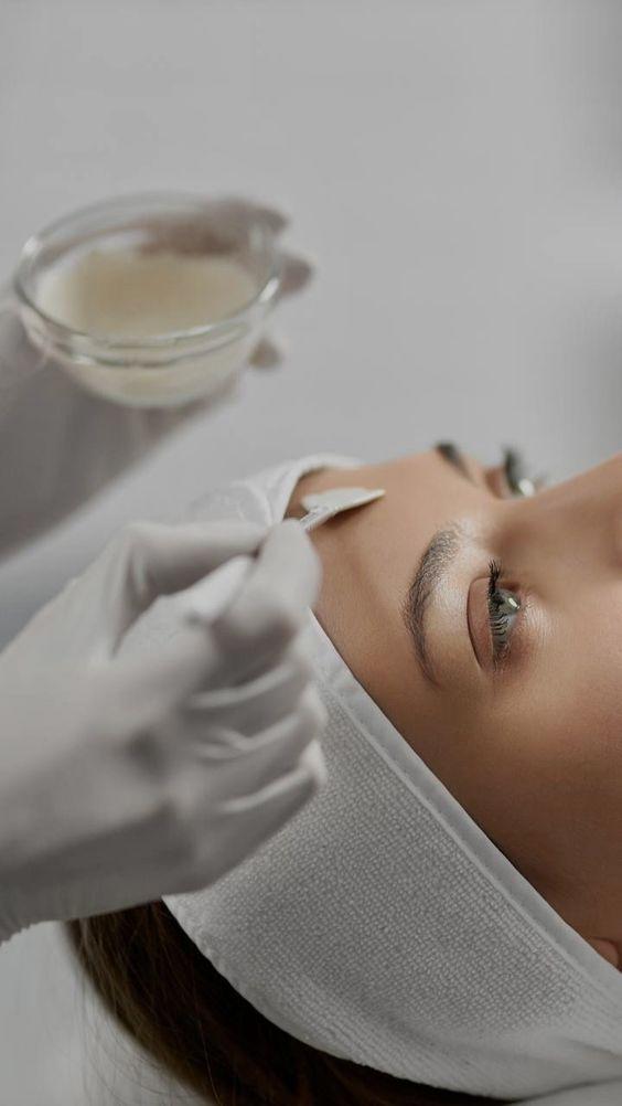 Aesthetician applying ClinicCare chemical peel