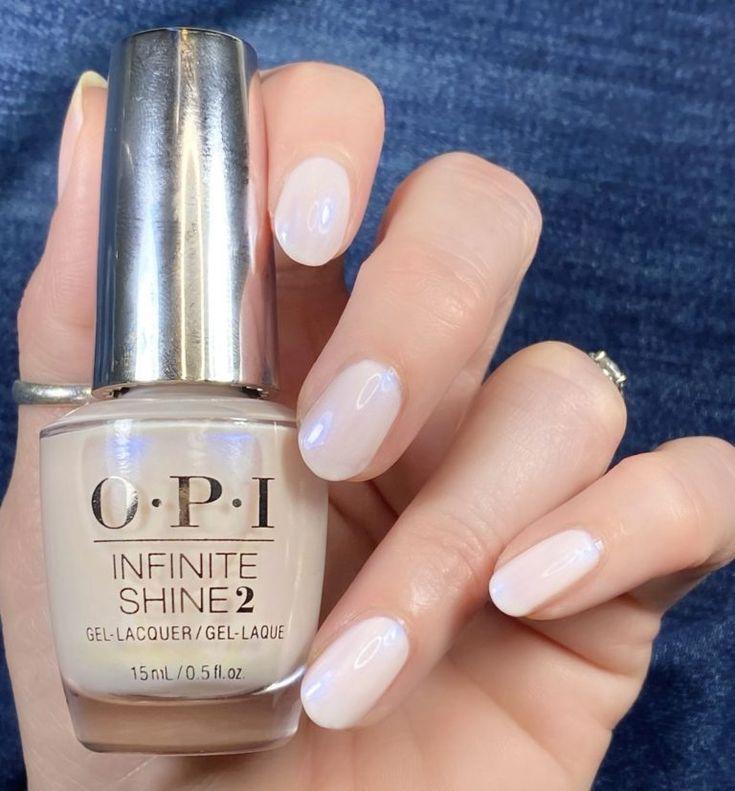 Client receiving an OPI manicure with cuticle care